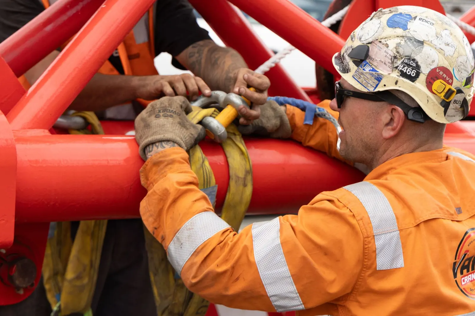 Rigger fastening a shackle